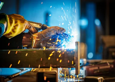 Close-up of welding with bright sparks flying from the metal seam